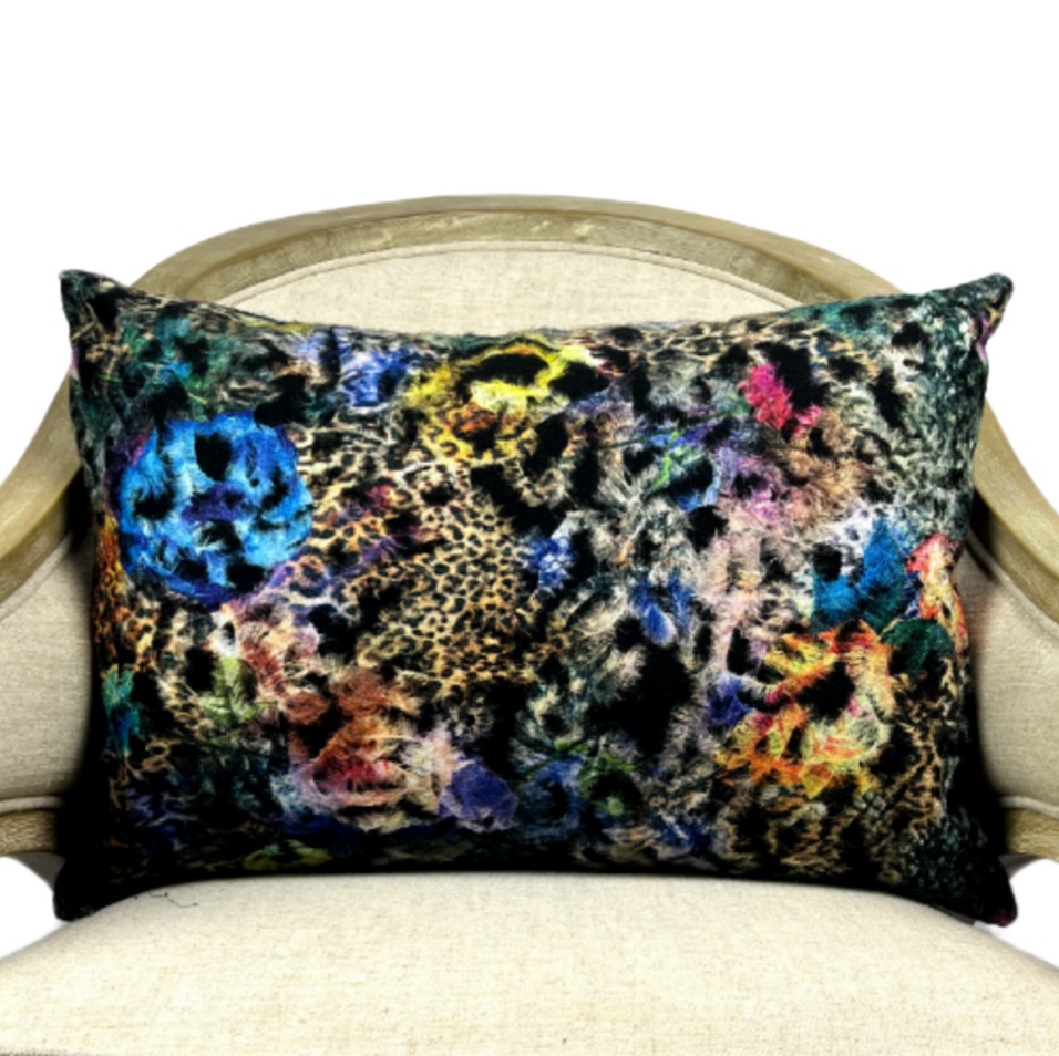 Multi color decorative pillow with scattered leopard motif